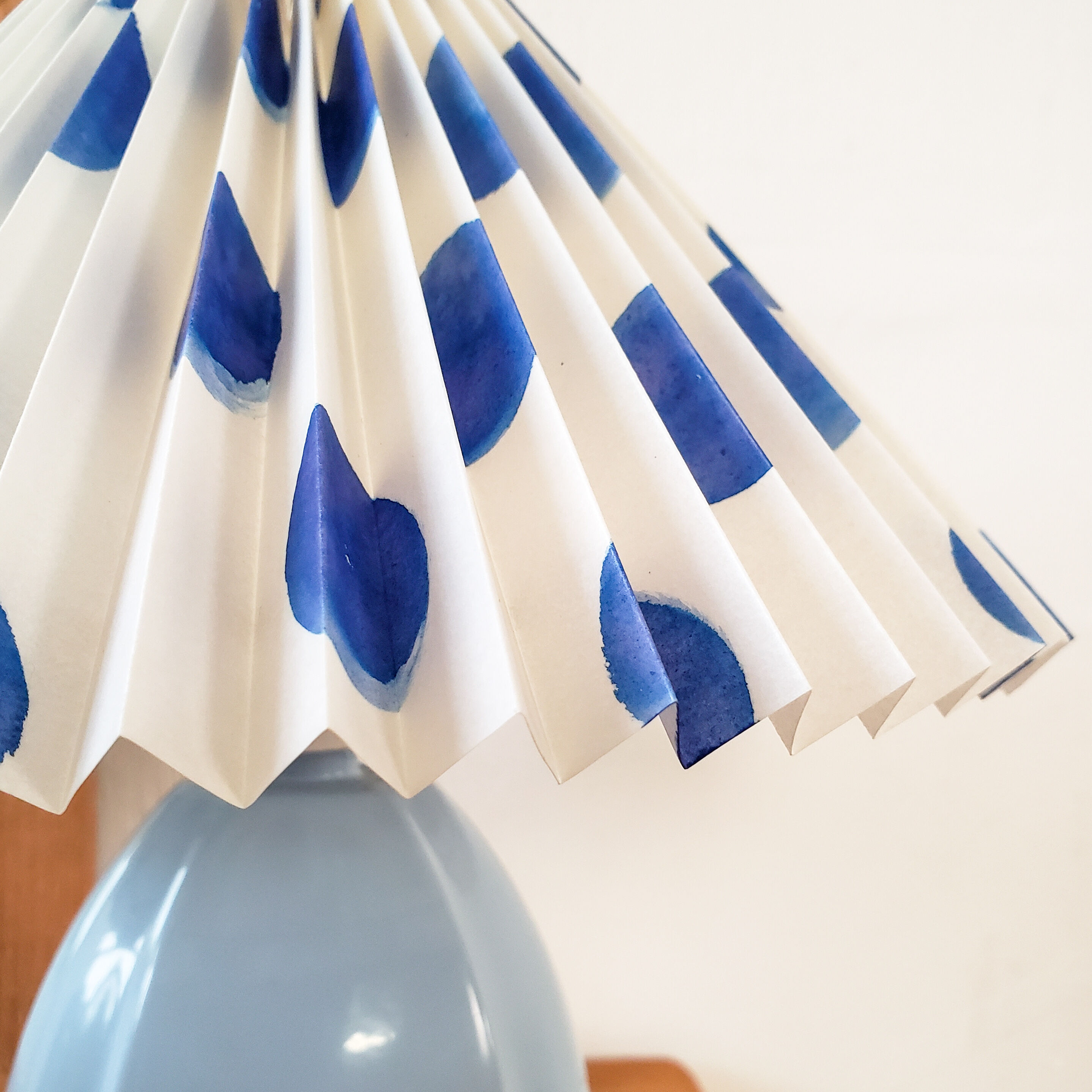 Blue lamp and pleated lampshade