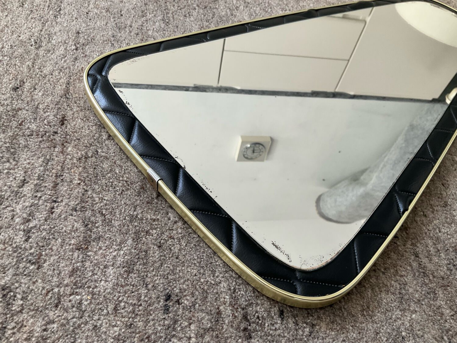 Asymmetrical mirror from the 1960s.
