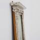 Pair of Neoclassical Silver Leaf Pier Mirrors with Ringed Columns and Corni