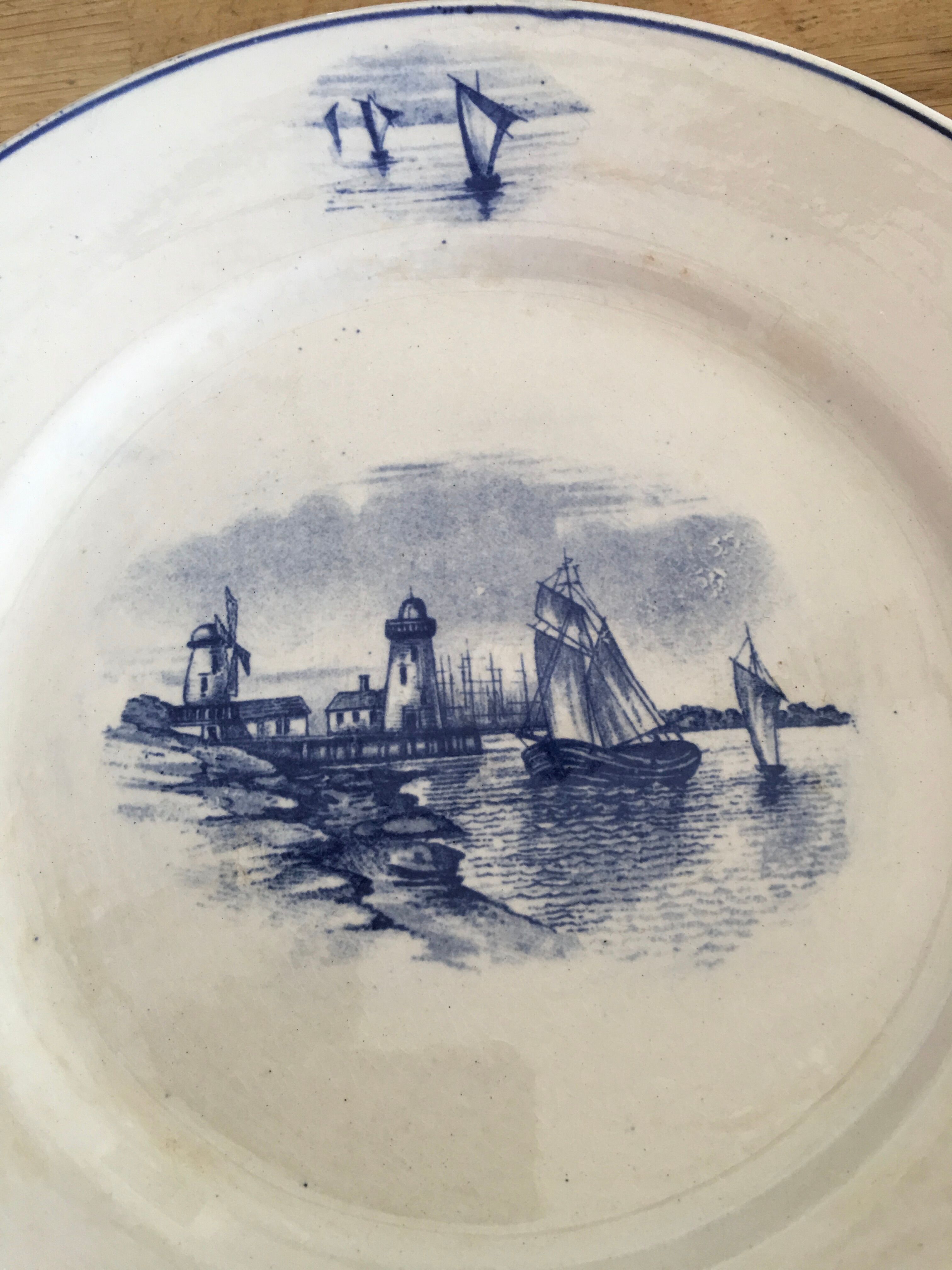 Series of 11 flat plates, Dutch earthenware, early XX