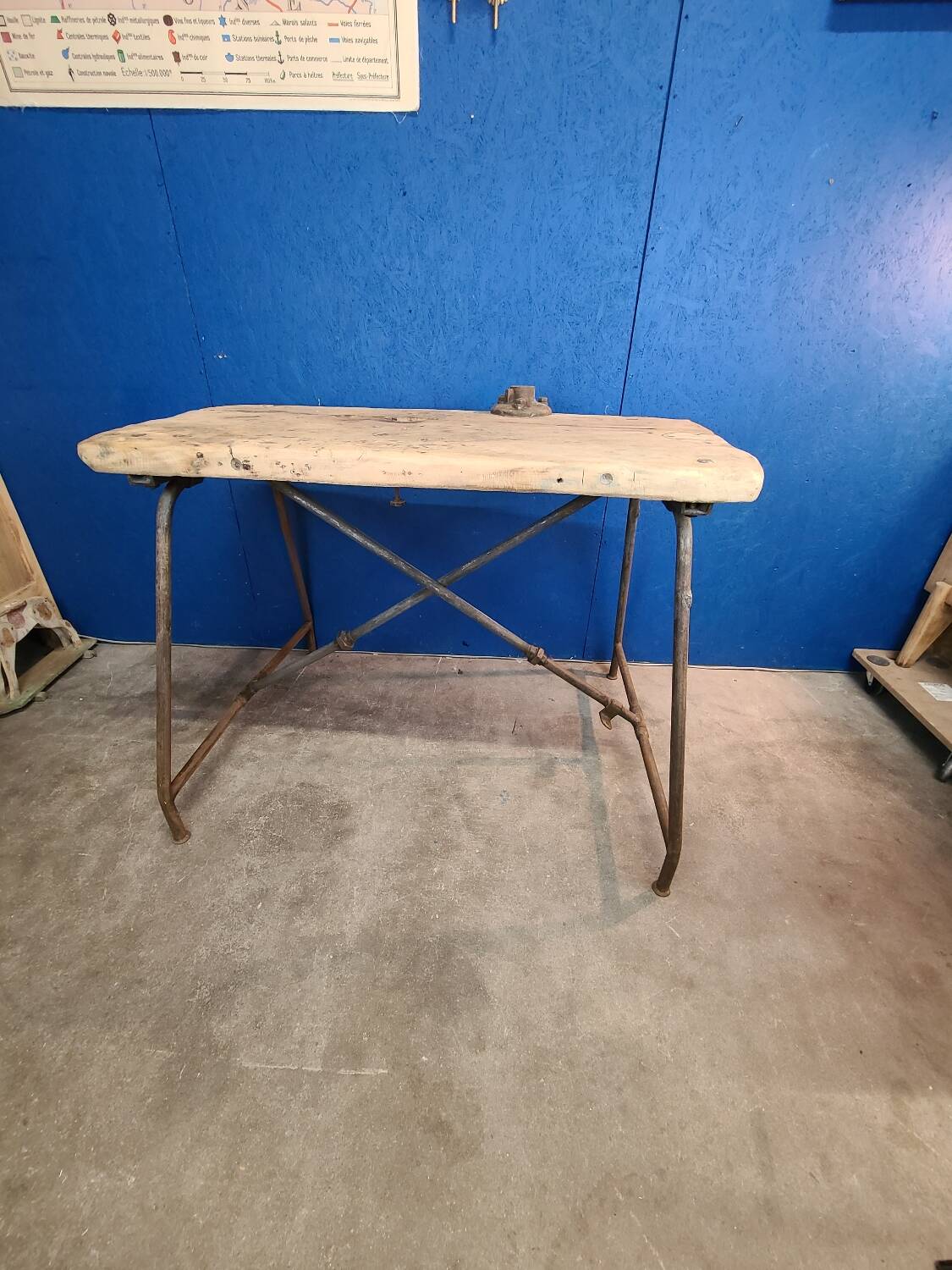 Vintage workbench circa 1930, folding metal leg.