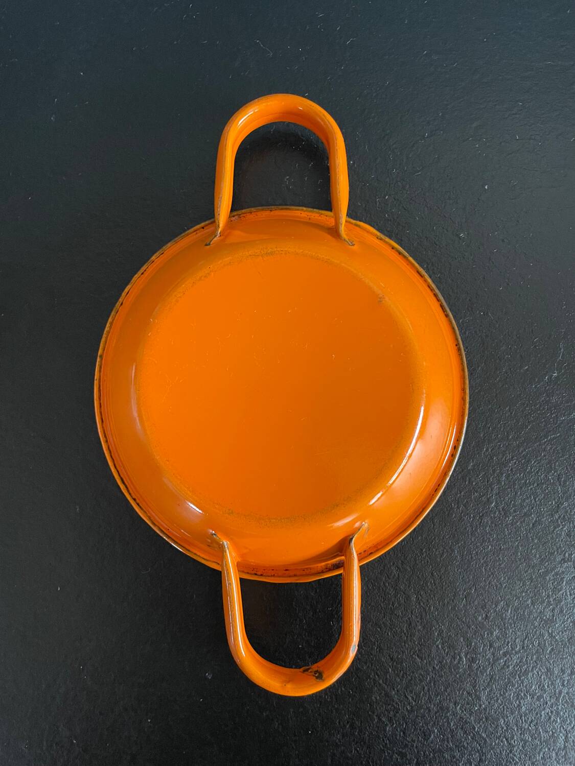 Orange enameled sheet egg dish
