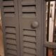 Dark grey wooden trompe l'oeil shutter mirror 1990 / wall decoration object Shutter-style mirror