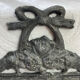 Patinated metal wall bracket and porcelain