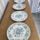 Four old blue plates