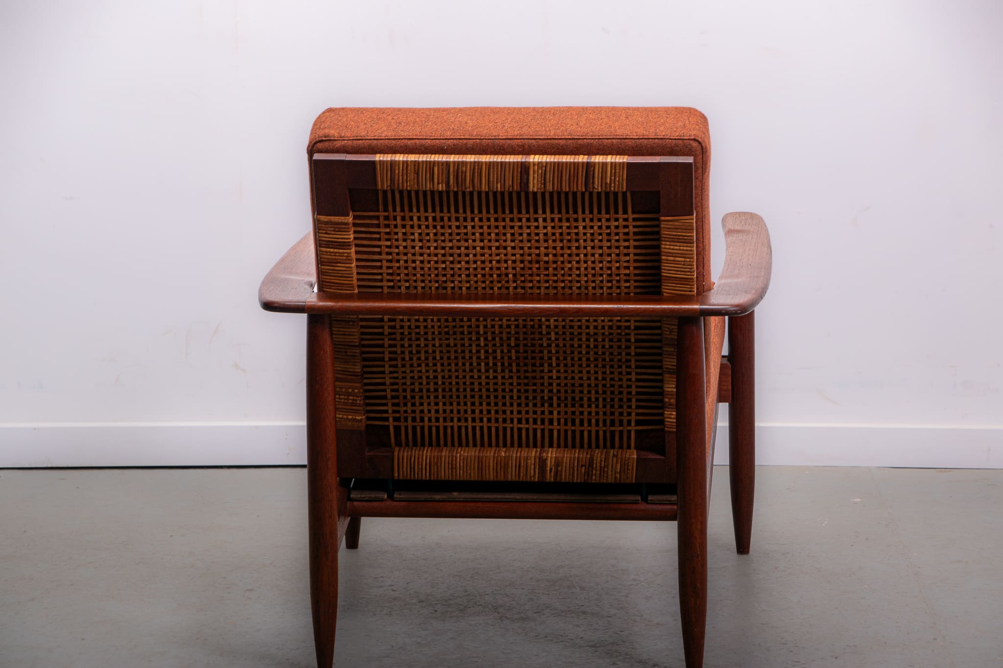 Mid-century easy chair in teak and cane circa 1970