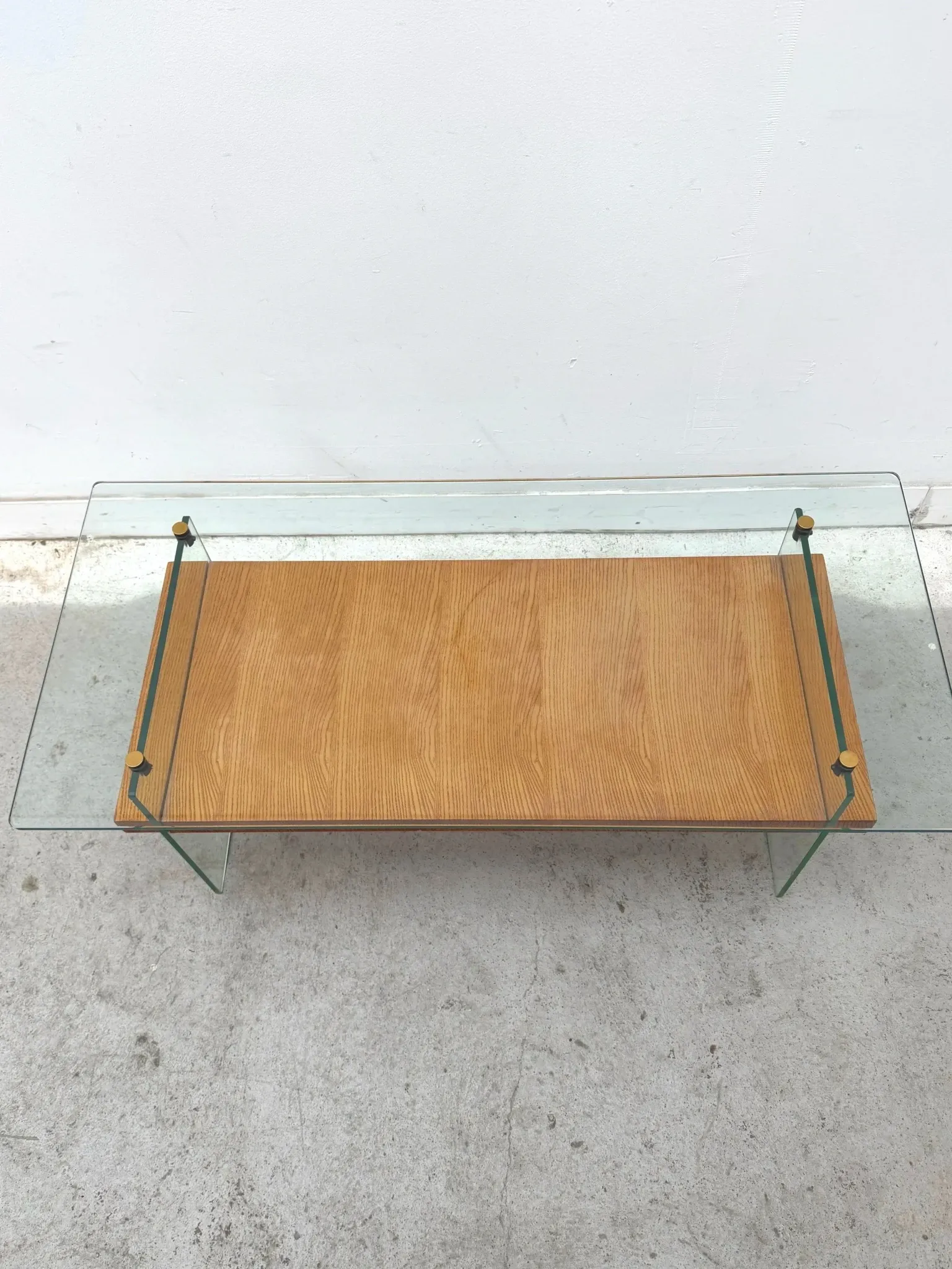 Coffee table by Robert Debiève in ash veneer, glass and brass, France 1950.