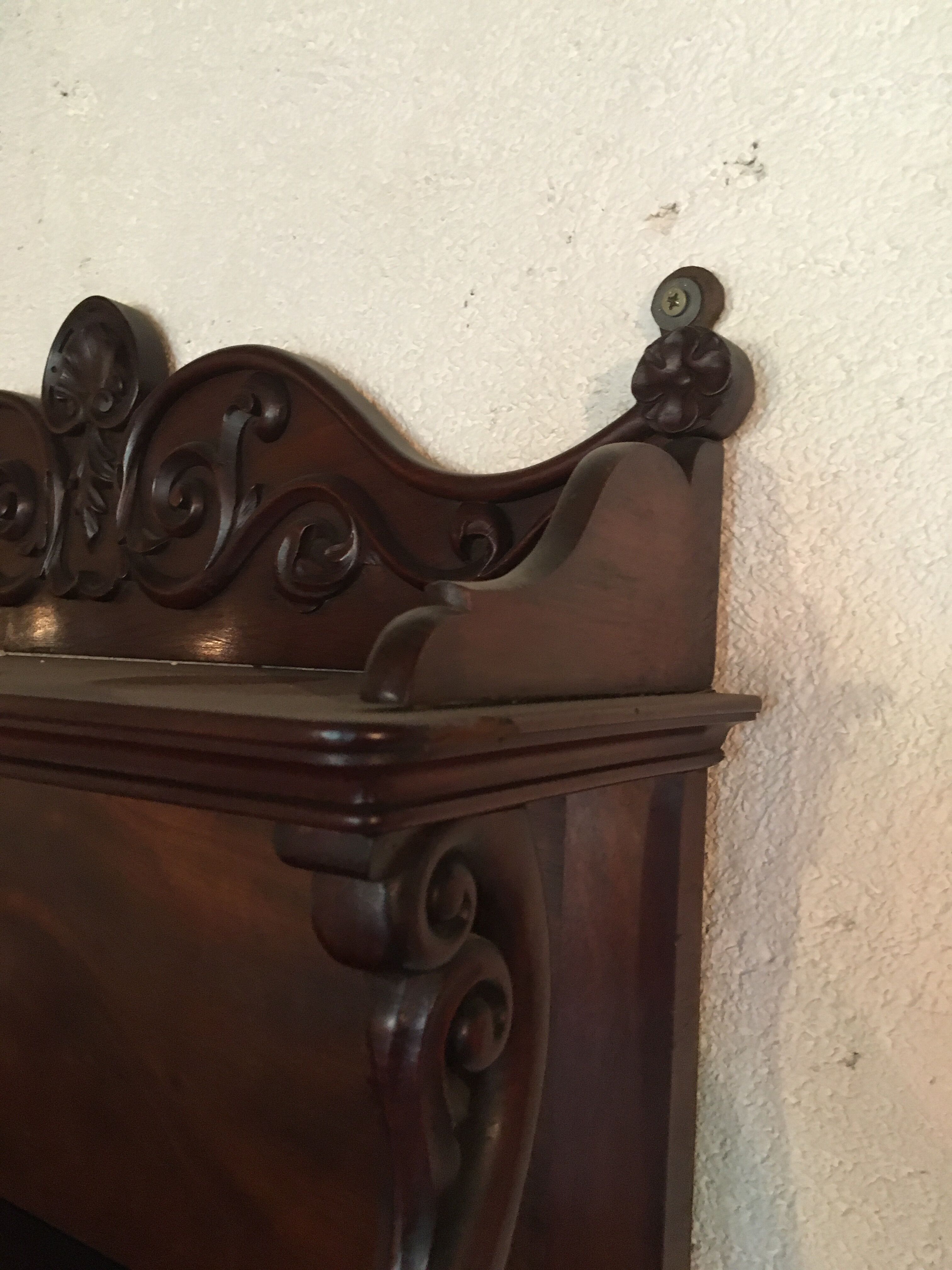 Carved wooden wall shelf.