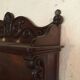 Carved wooden wall shelf.