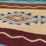 Multicolored hand-woven Berber rugs in natural wool