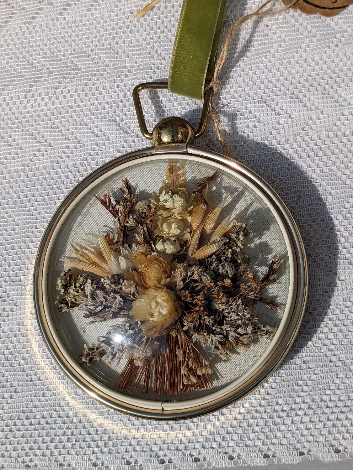 Domed frame of dried flowers