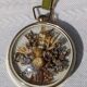 Domed frame of dried flowers