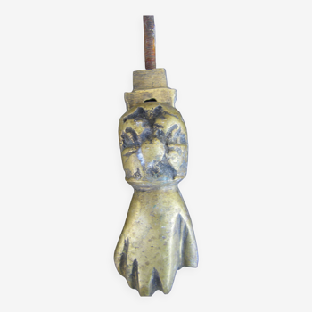 Hand-shaped door knocker