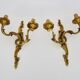 Antique pair of double-light bronze wall sconces with acanthus leaves. 1950s