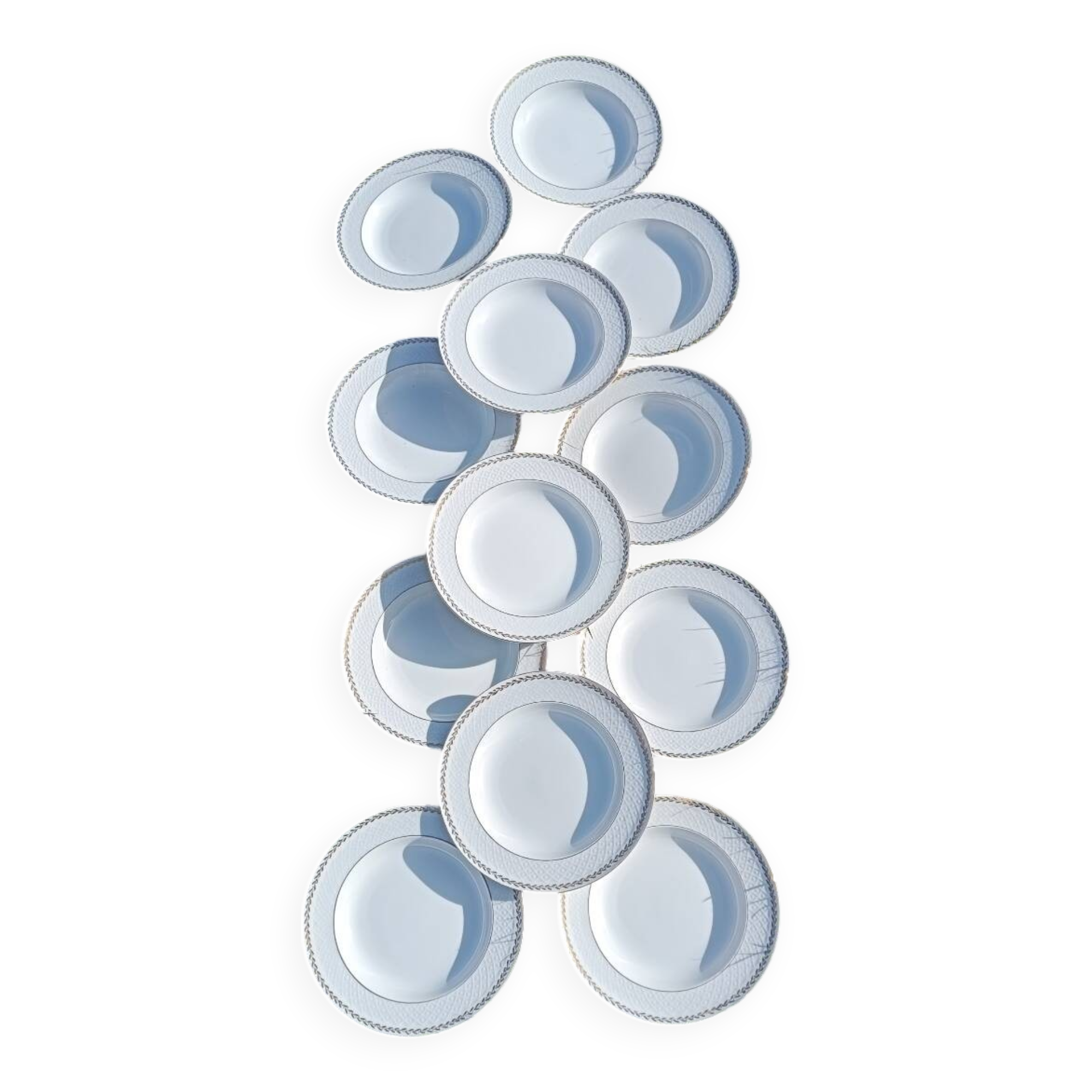 Twelve white porcelain plates