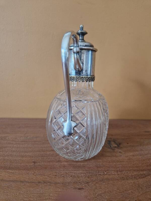 Cut crystal carafe and silver-plated metal
