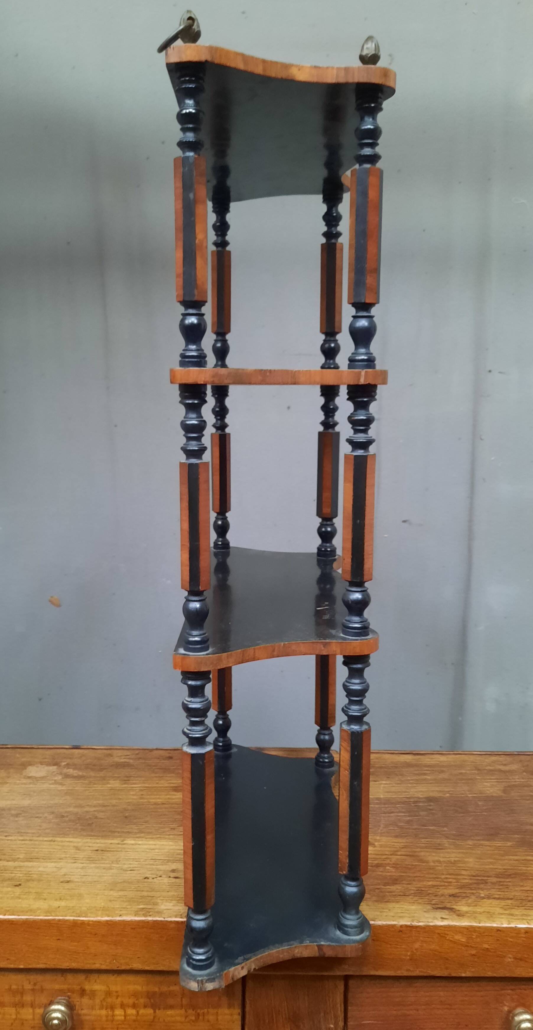 Blackened wooden wall shelf