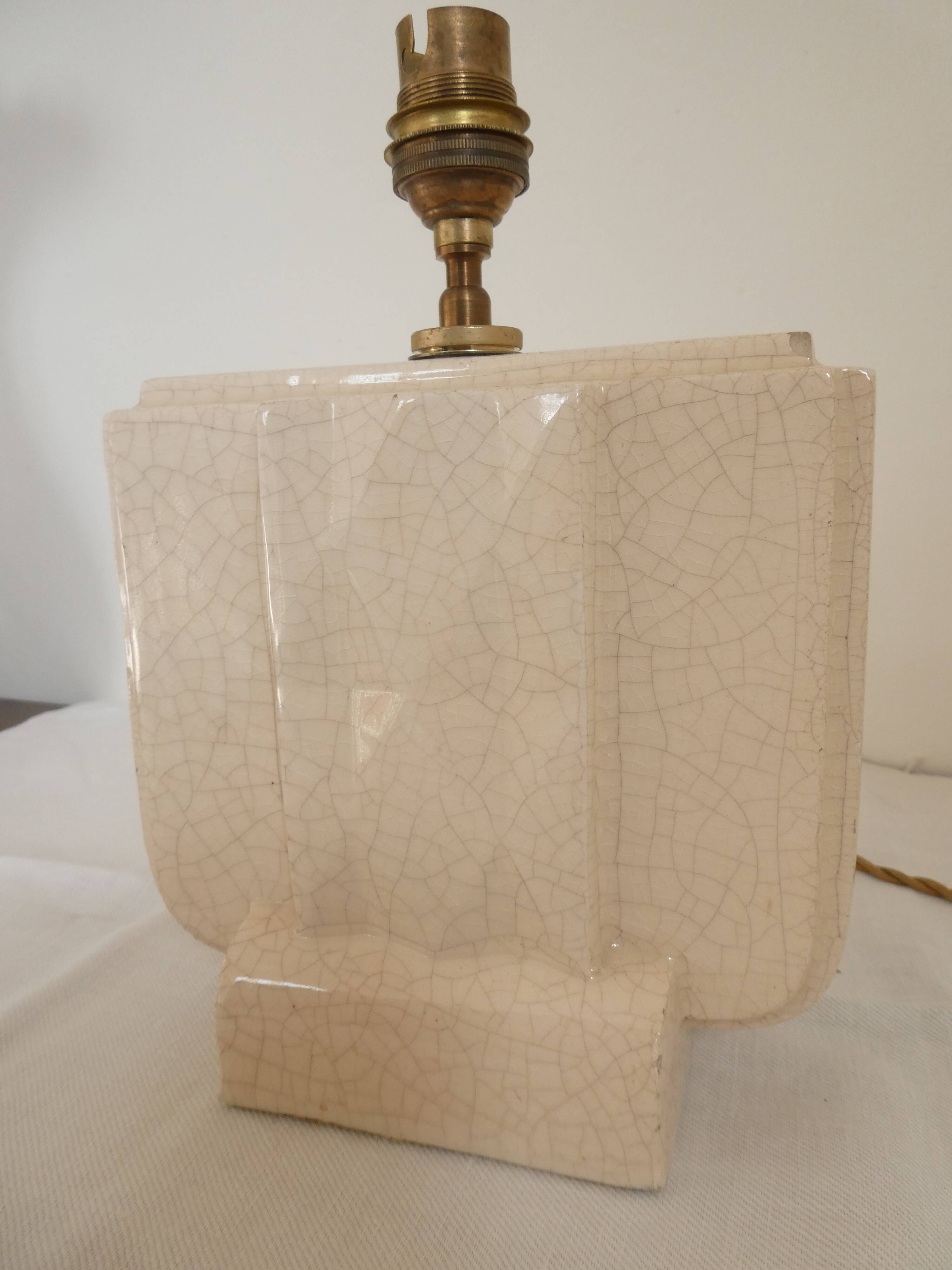 Cream cracked ceramic lamp base in Scandinavian style.