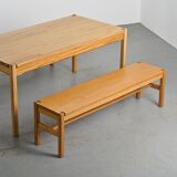 Table and two benches set in solid elm, France, circa 1980