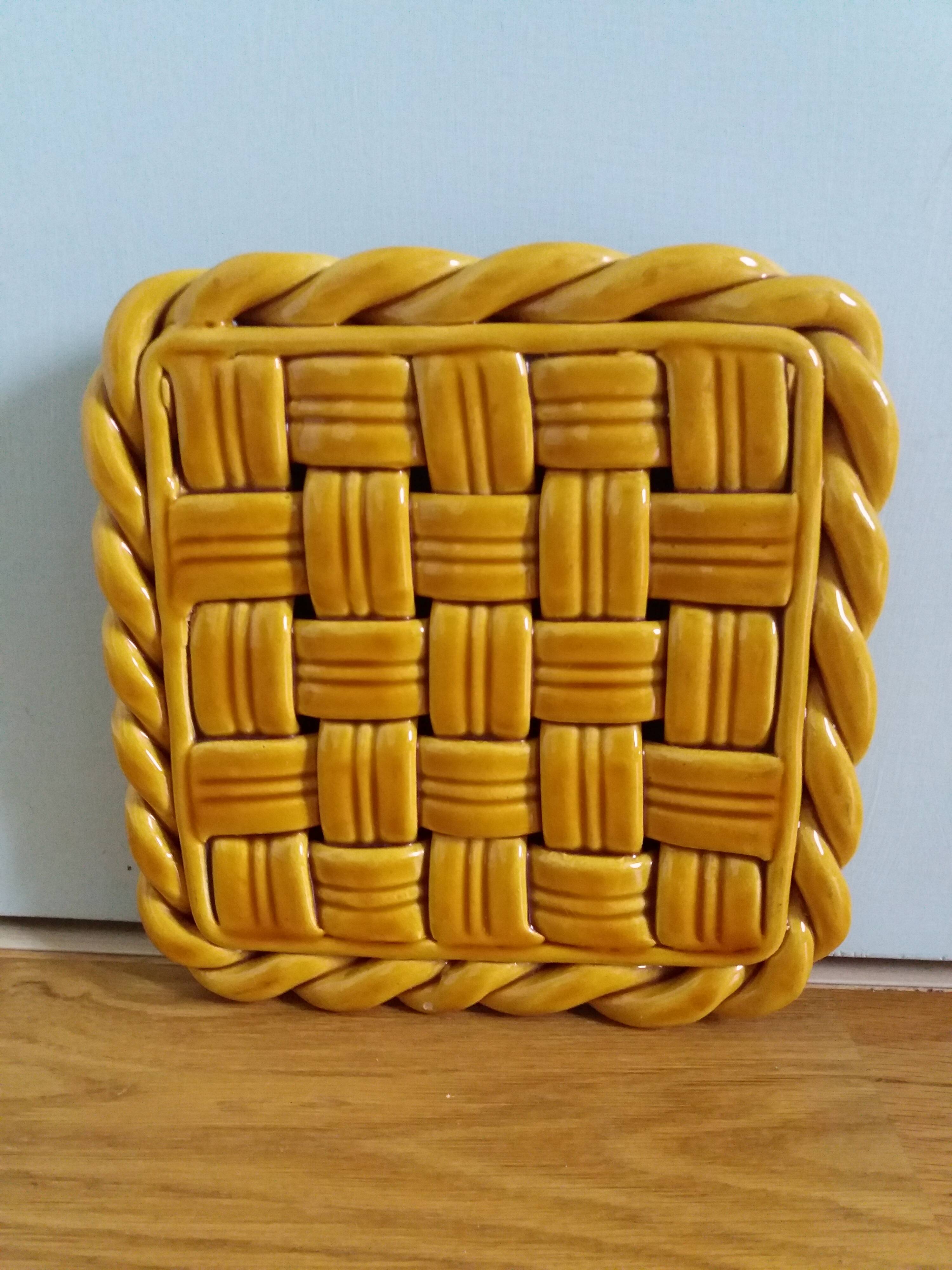 Openwork woven ceramic trivet