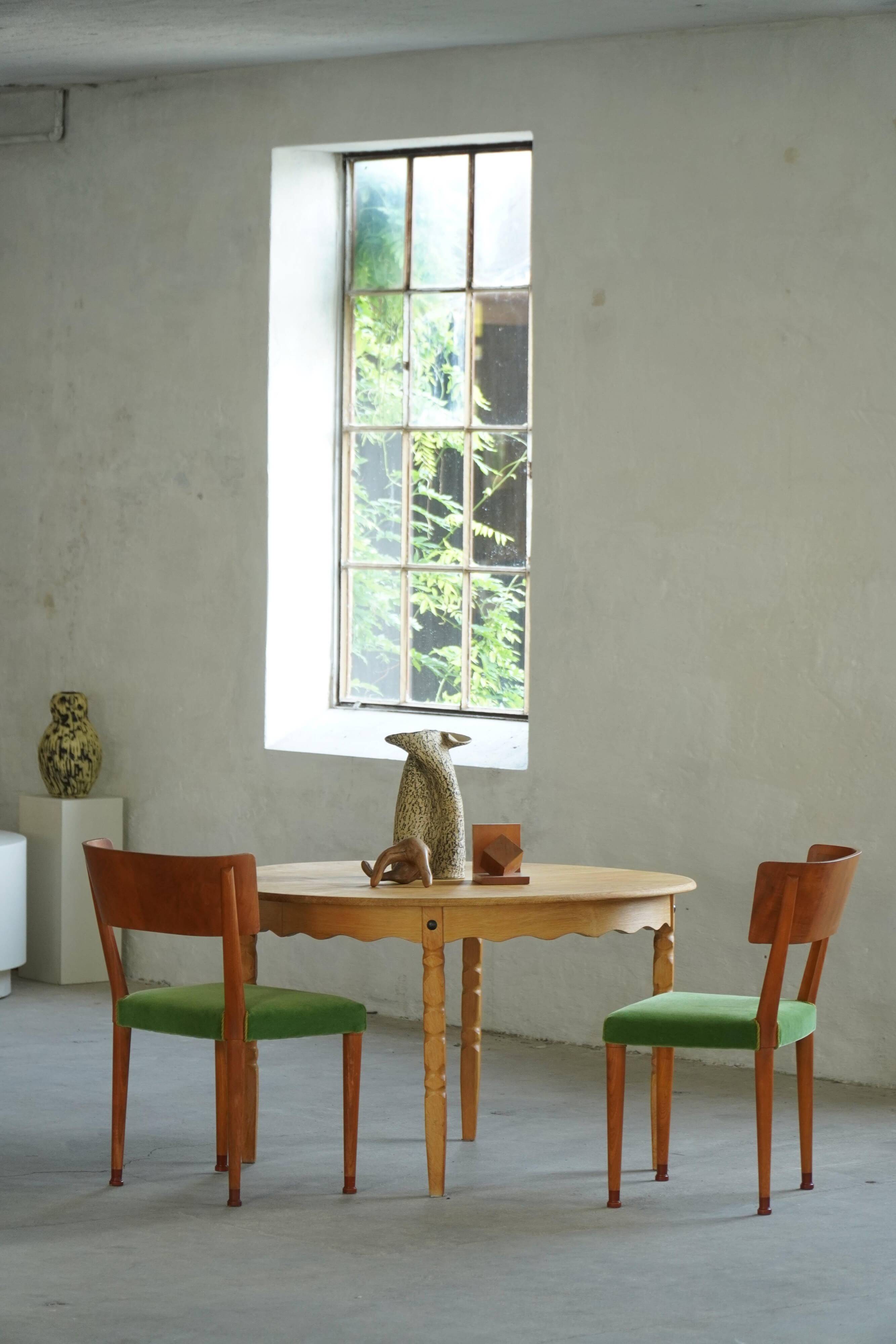 Round solid oak dining table with three extensions, mid-century Danish style, 1960s.