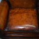 Two-seater canapé in aged leather, Victorian style.