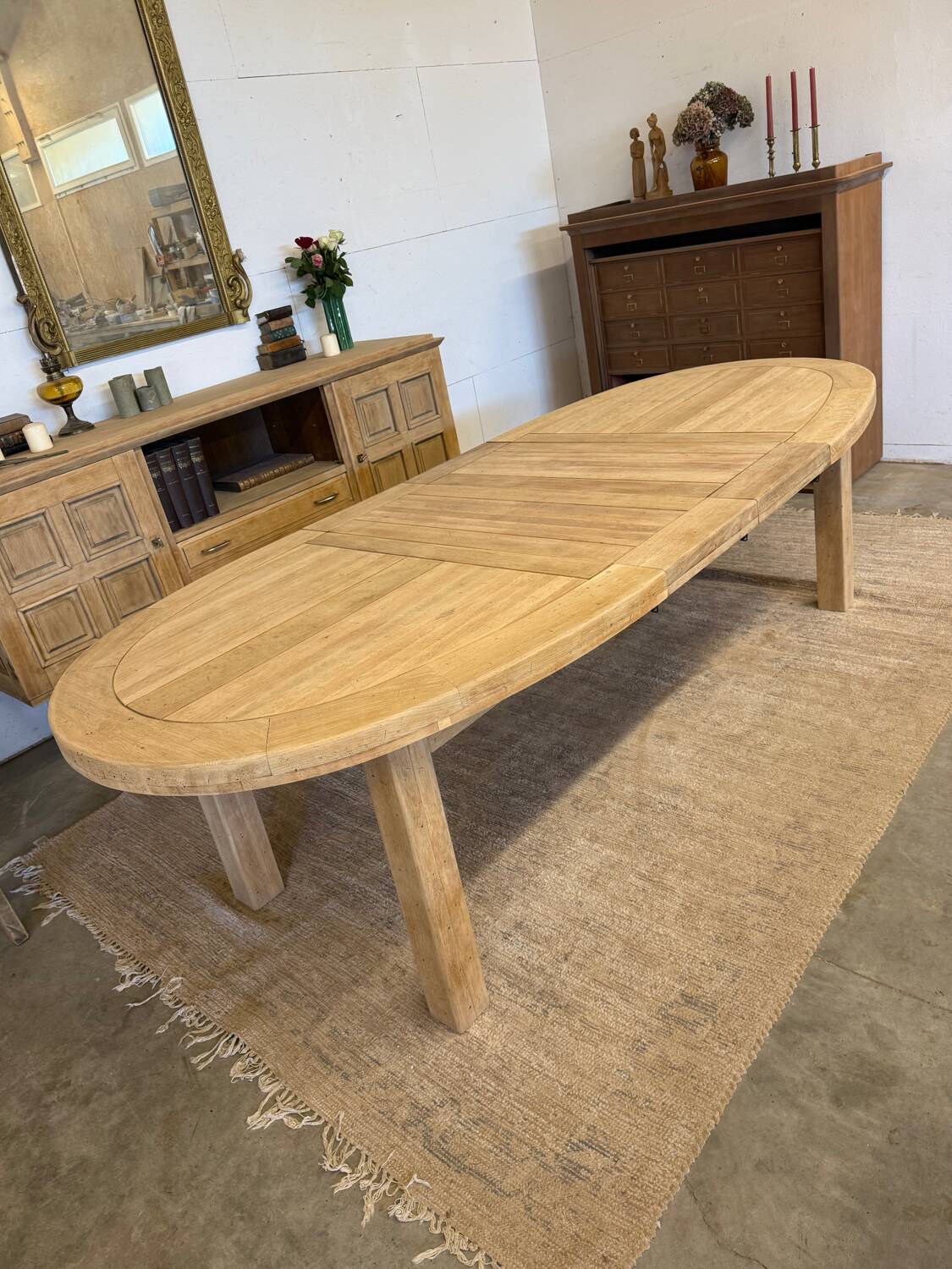 Oval farmhouse table in solid oak with extensions.