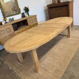 Oval farmhouse table in solid oak with extensions.