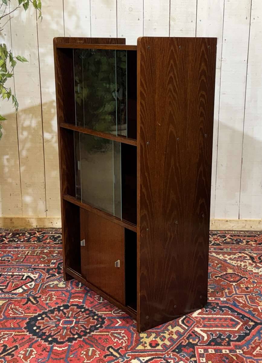 Small English oak library from the 1960s with sliding doors.
