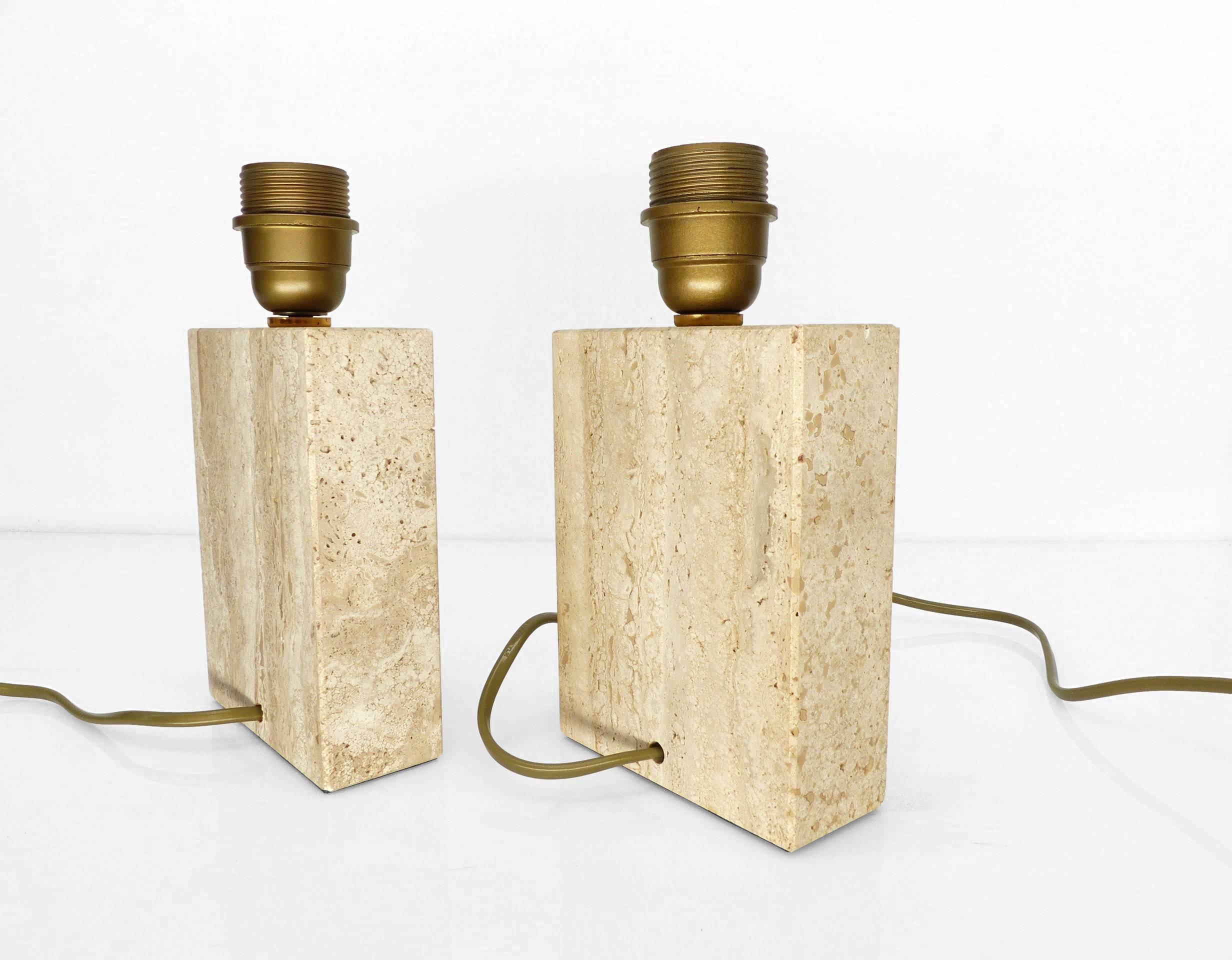 Pair of solid travertine table lamps with incised decoration, French production.