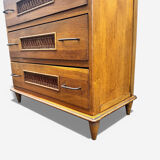 Vintage 1970s chest of drawers: wood and rattan, splayed legs.