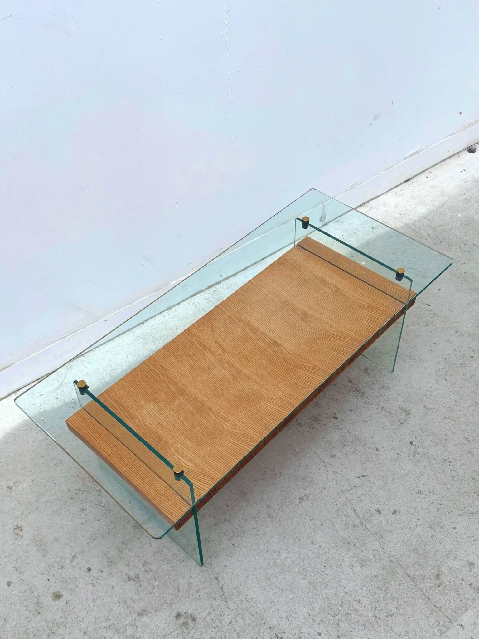 Coffee table by Robert Debiève in ash veneer, glass and brass, France 1950.