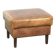 Cowhide ottoman with a beautiful patina finished with decorative nails