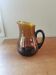 Vintage round pitcher amber glass