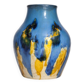 Baluster vase in Belgian ceramic with flowing blue and yellow glazes.