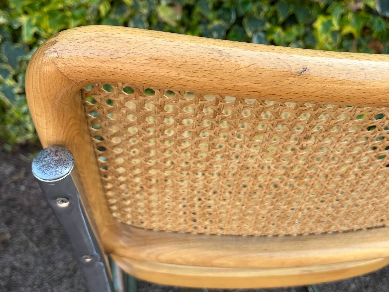 Wooden chair with caning in the style of Marcel Breuer.