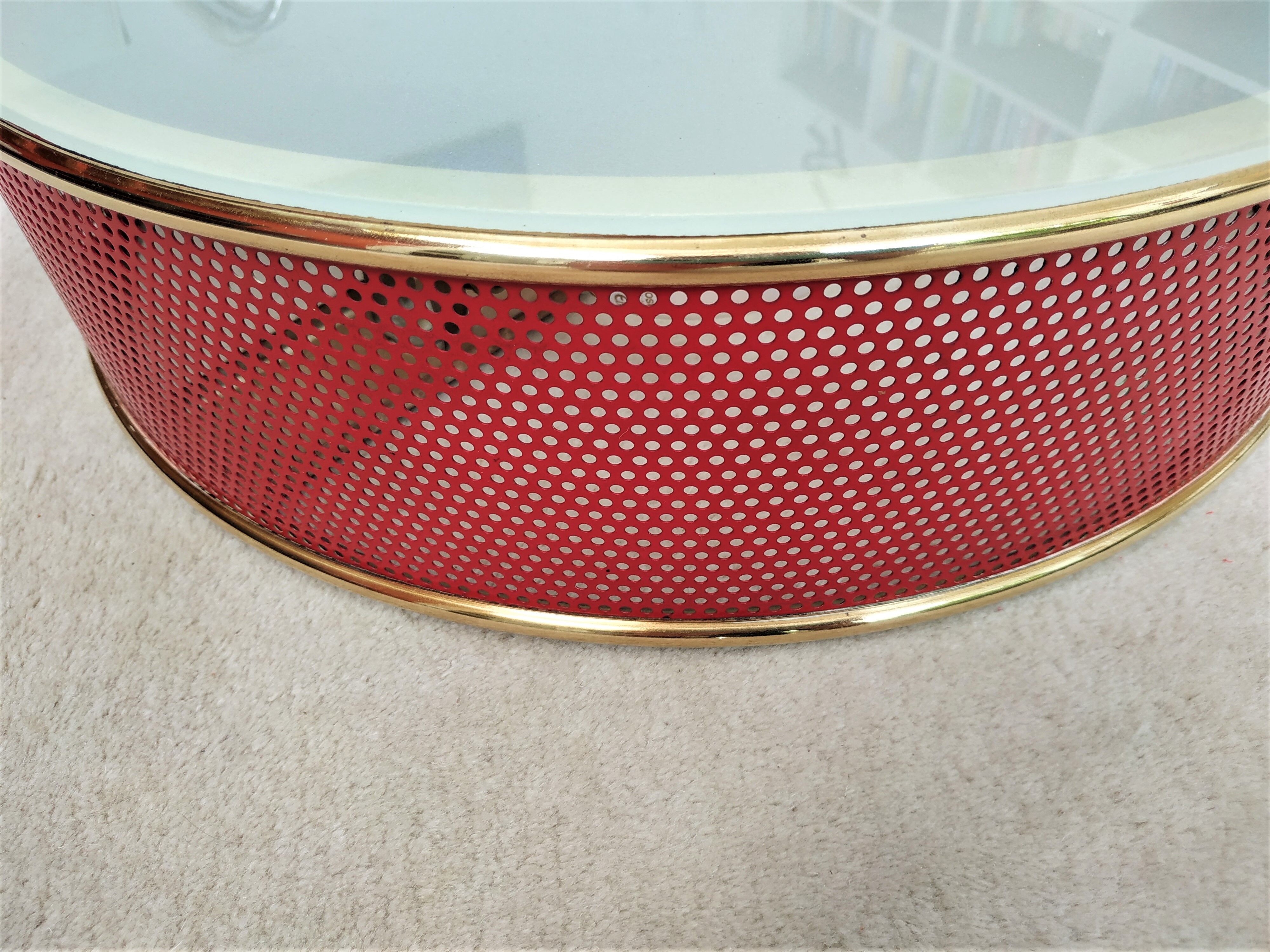 Ceiling lamp applied in red lacquered perforated metal