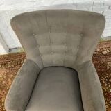 Swivel armchair in velvet fabric and metal