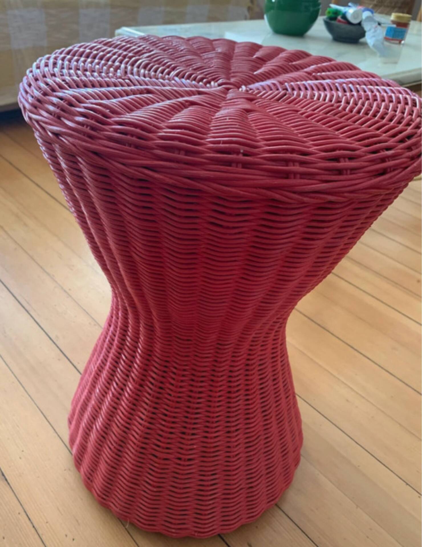 Vintage hourglass stool in red wicker or woven rattan.