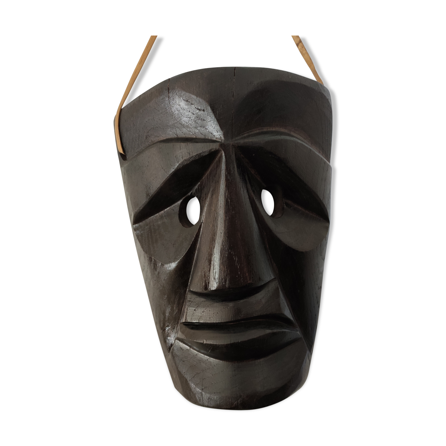 Ethnic ebony wood mask for display or hanging.