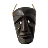 Ethnic ebony wood mask for display or hanging.