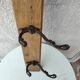 antique coat rack with 3 cast iron hooks