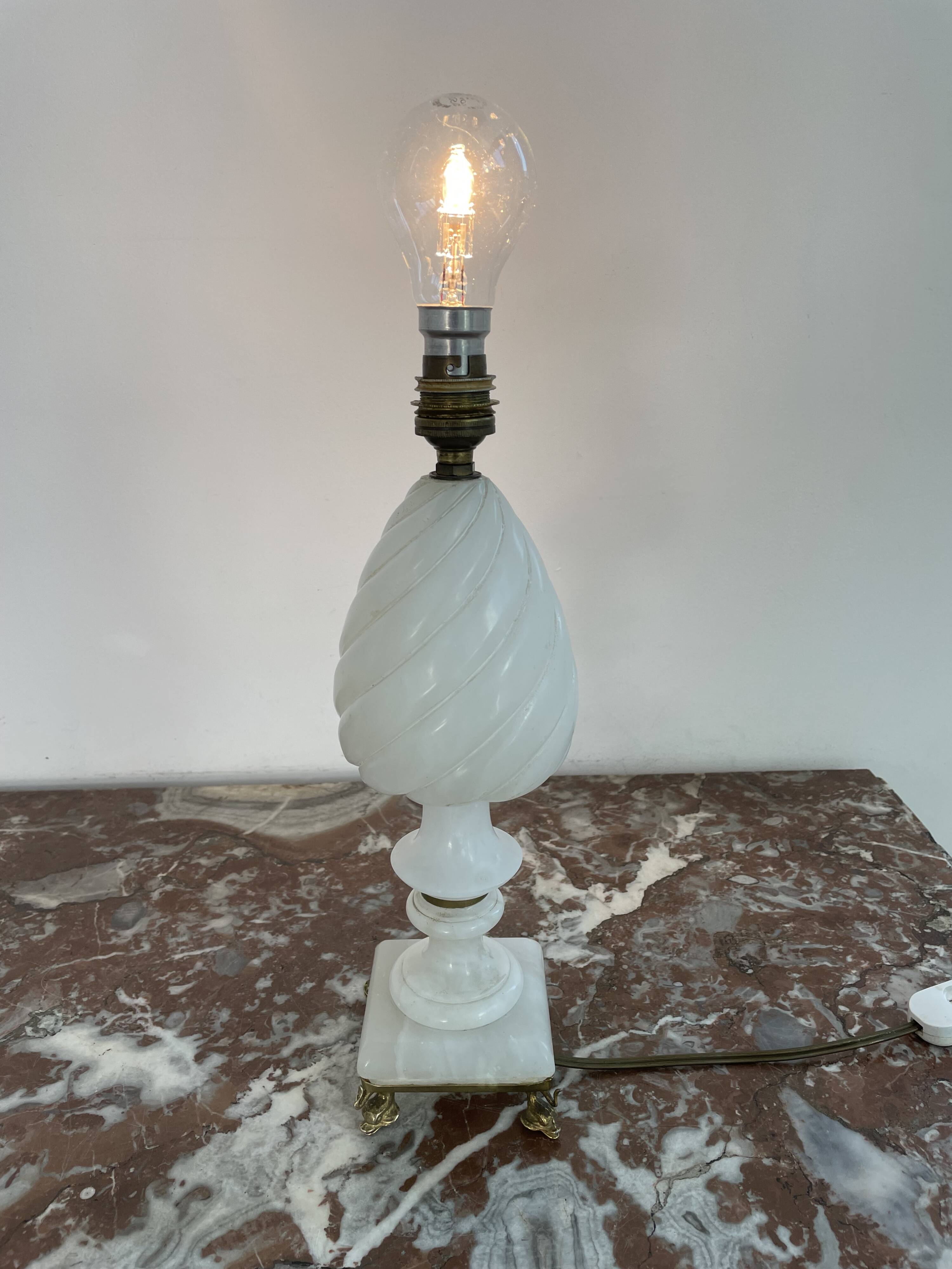 Alabaster lamp, twisted, gadroon decoration, gilded brass base, dolphins