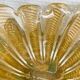 Murano glass scallop shell bowl from Italy with gold glitter trim.