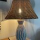 Blue ceramic lamp and rattan