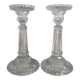 Column candle holders in moulded glass made in France.