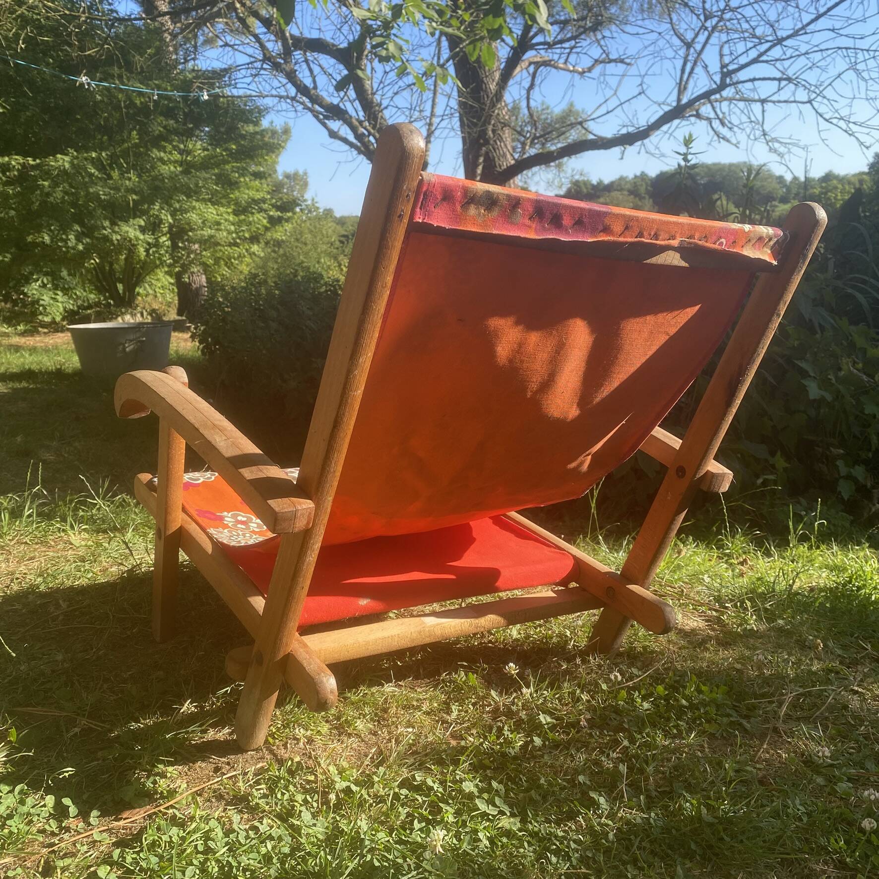 Vintage beach or garden chair made of wood and floral fabric, 1970s.