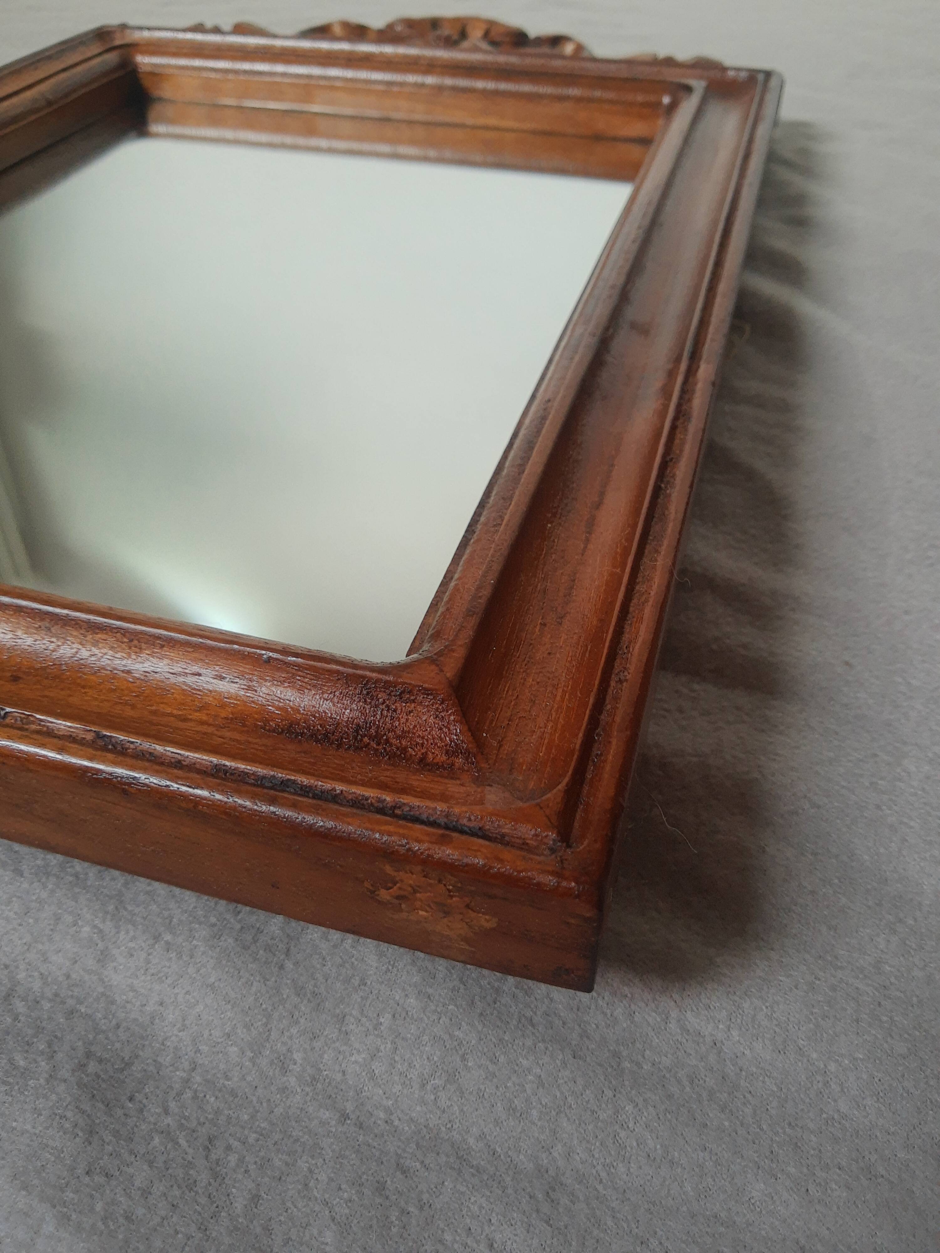 Wooden hanging mirror with vintage carved knot