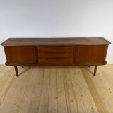 Vintage teak sideboard with rounded edges and sliding doors – mid-century Scandinavian design.
