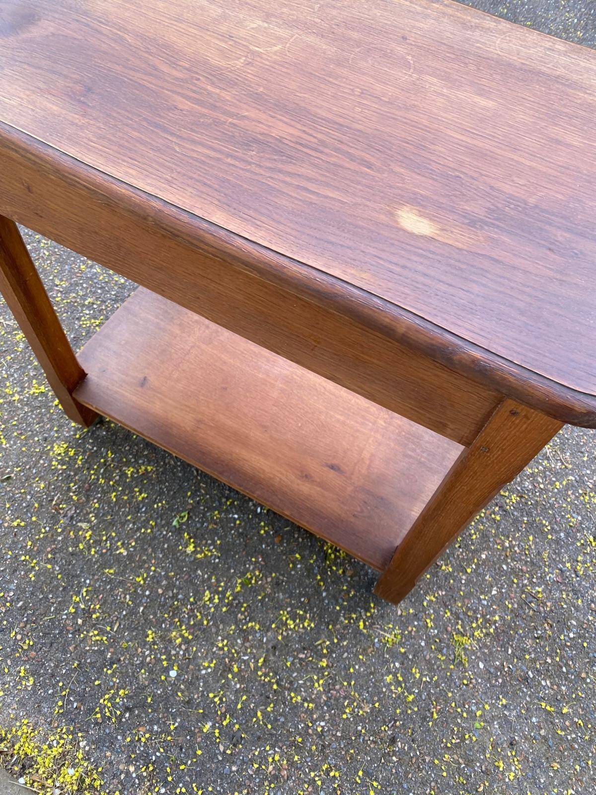 Vintage farmhouse dessert trolley on wheels made of solid wood from the 19th century.